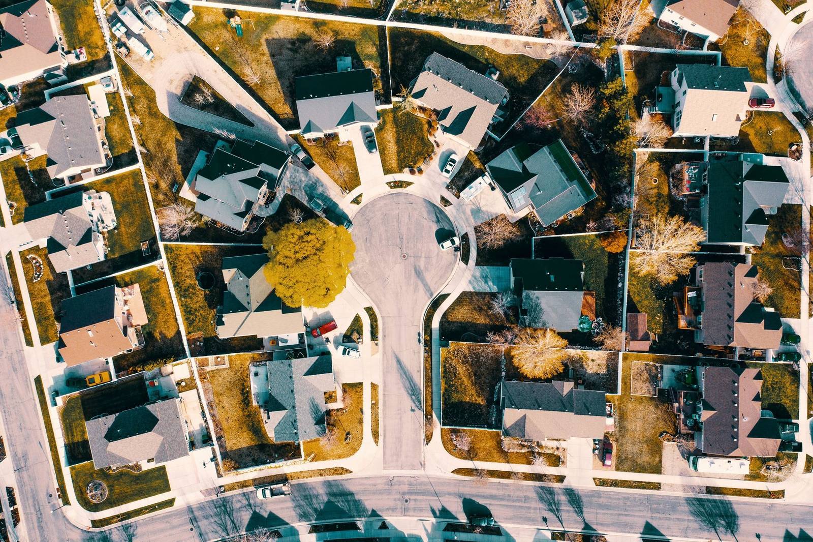 Aerial view of homes on wooded lots